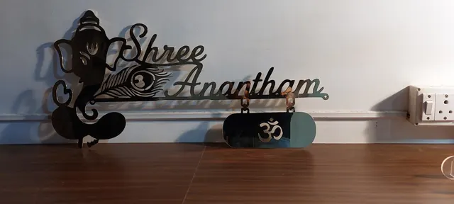 Laser-cut black steel house nameplate with Ganesh motif