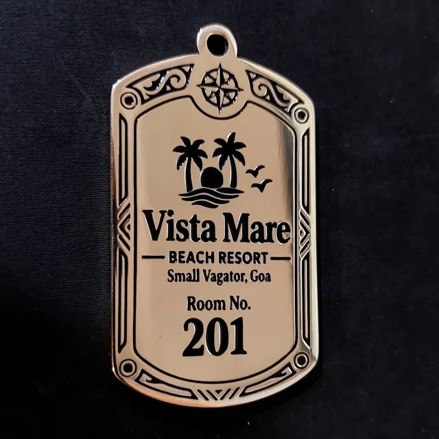 Brass room key tag for Vista Mare Beach Resort, Small Vagator, Goa, engraved with palm logo, border and Room No. 201