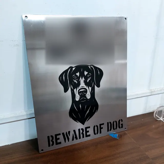 Engraved stainless steel house sign with dog portrait, name blurred
